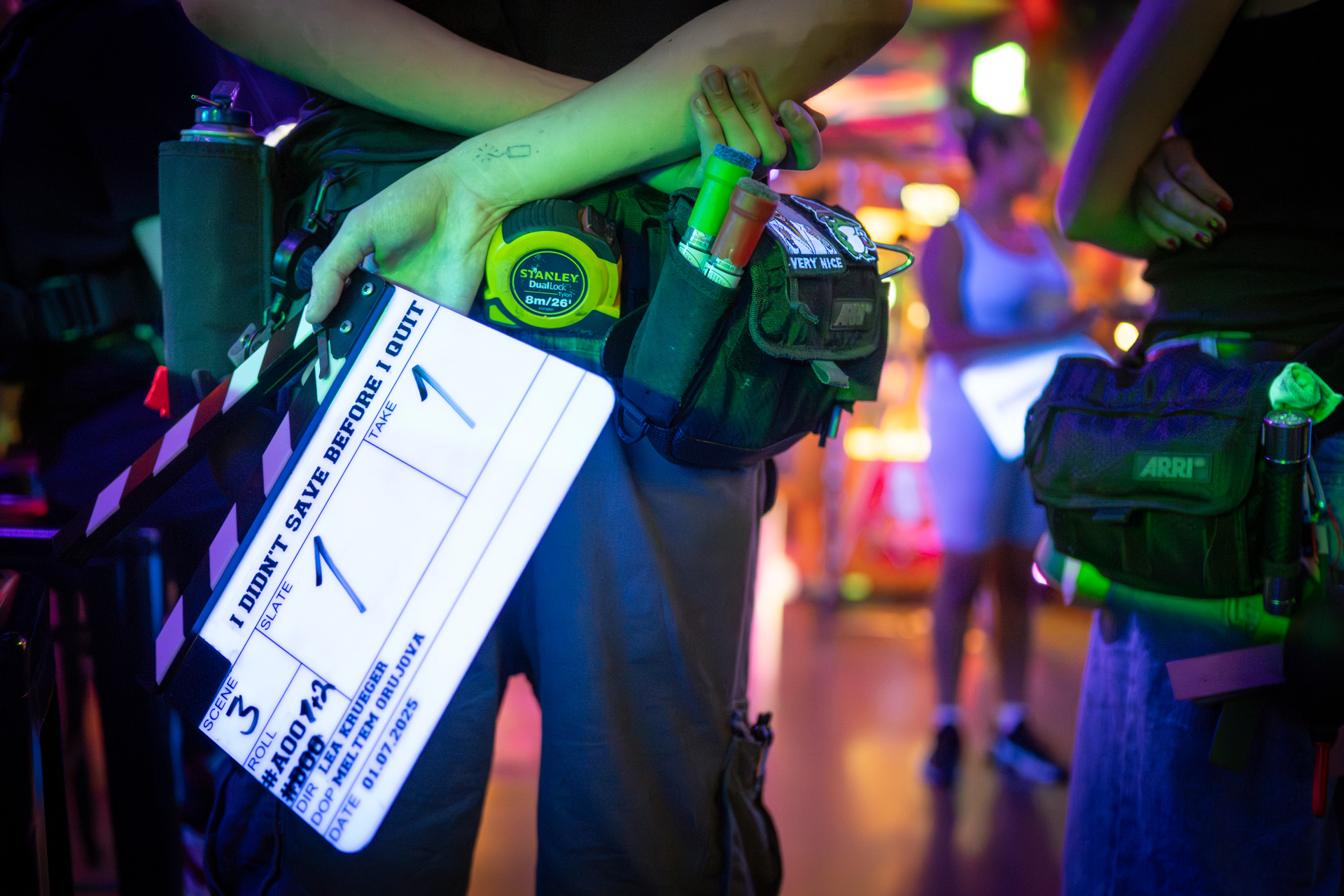 Clapper-board-behind-back-compressed